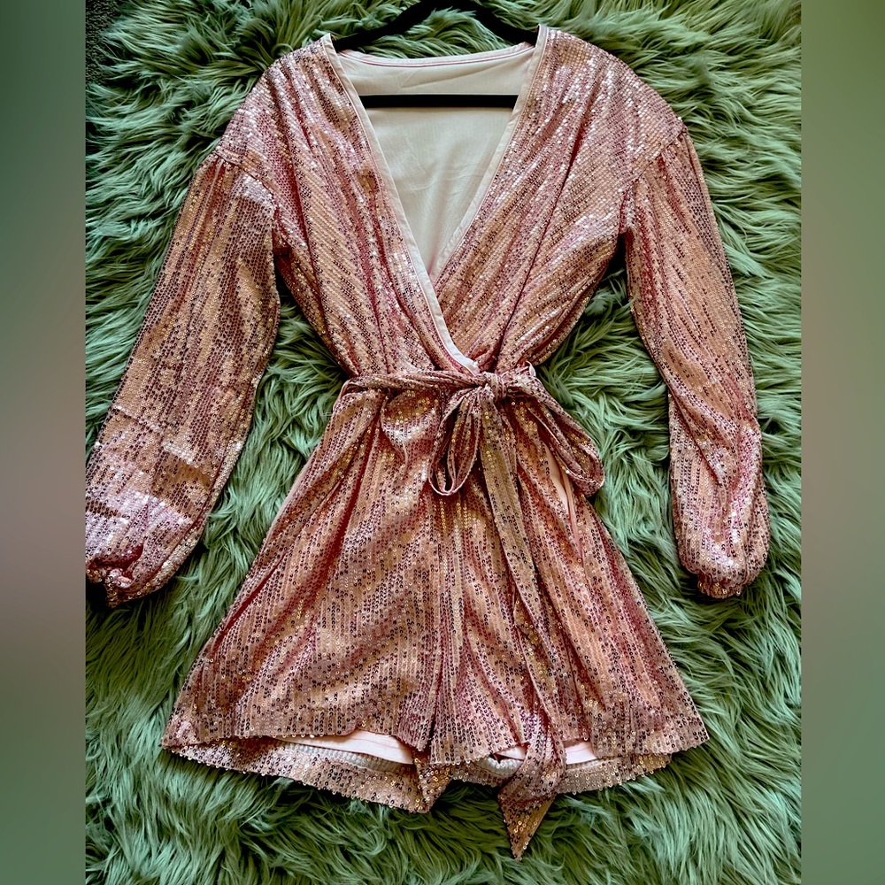Women’s New without tags pink sequence romper. Size medium